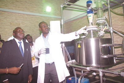 Mr Ato Hope, Operations & Productions Manager, Asap Vasa Company Limited, explaining a point to Mr Alhaji Inusah Fuseini (left), Minister of Lands and Natural Resources, during a visit to the company's refinery in Accra.  Picture: EMMANUEL BAAH