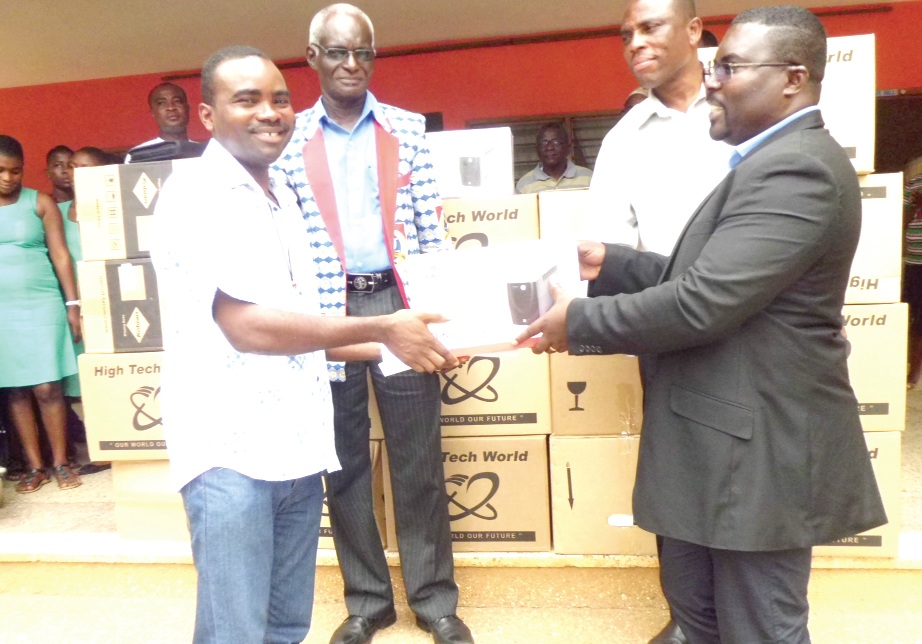 Mr Quashigah (right) presenting a UPS to the Superior of the Servants of Charity, Rev. Father Emeka Leonard Owuamanam, at the ceremony.