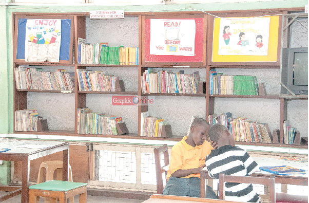  The children's library with a couple of young boys reading.