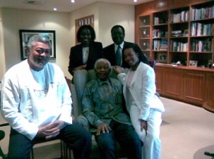 The Rawlings family in a pose with Nelson Mandela