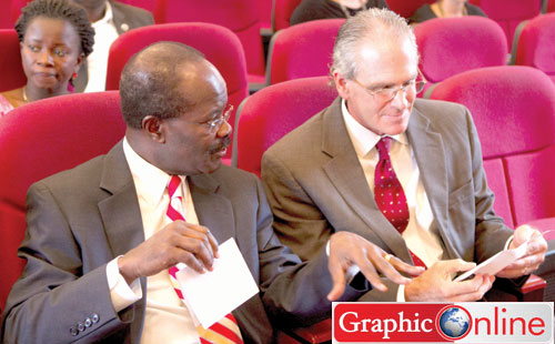 Dr Papa Kwesi Nduom holding discussions with Mr Piet Devries, Chief of PArty of Global Communications, parent company of LEDFC at the ceremony