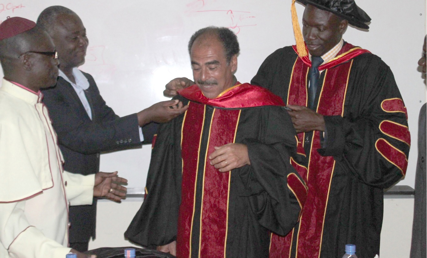  Mr Kalmoni being decorated with the academic gown