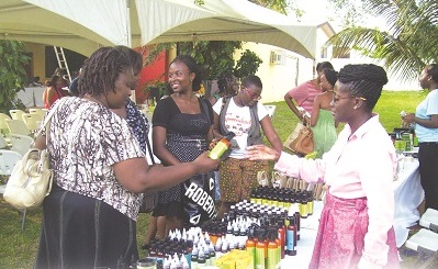Prospective buyers checking some sheabutter products