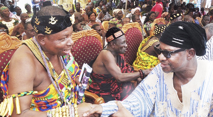 Dr Seidu Danaah (right), Minister for Chieftaincy and Cultural Affairs greeting Nene Nornor Sordje V, Acting President of the Shai Traditionla Area.