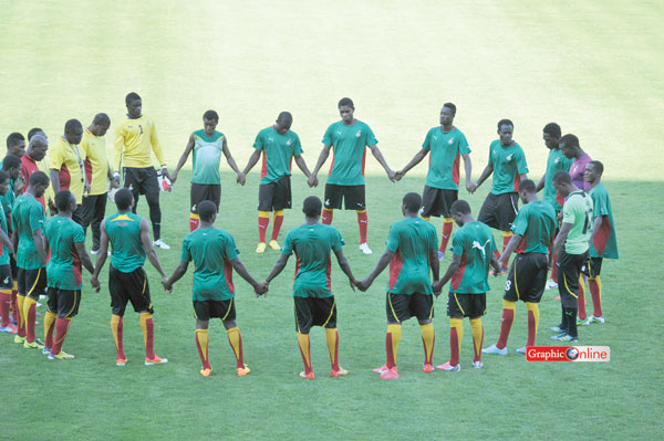 Black Satellites in a prayer during a training session in Bursa