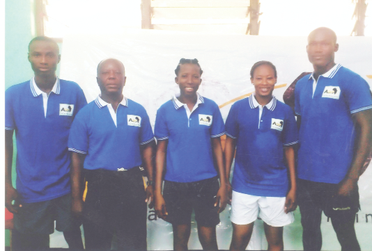 Coach Anthony Owusu Ansah (2nd left) with the Black Loopers after winning the Zone III tournament