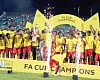 Players of Asante Kotoko celebrating their MTN FA Cup triumph  with the trophy after beating Golden Kick 2-1 yesterday