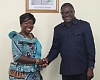 Elizabeth Ofosu-Adjare (left), Minister of Trade, Agribusiness and Industry, in a handshake with Dr Humphrey Kwesi Ayim-Darke (right), President, AGI