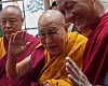 The Dalai Lama, centre, greets people as he arrives at an event a day before his 90th birthday. Pic: AP/Ashwini Bhatia