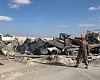 U.S. troops clear debris following an Iranian missile strike at the Ain al-Assad air base in Iraq on Jan. 8. No one was killed, and U.S. officials initially said no American service members had been injured.  Ali Abdul Hassan/AP