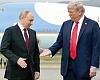 US President Donald Trump, right, reaches out to shake hands with Russian President Vladimir Putin.