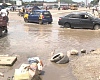 Drivers driving through flood waters at Dansoman Hansonic
