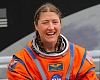 Christina Koch becomes first woman to travel around the moon on Artemis II