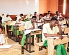 Candidates writing their Basic Education Certificate Examination at the Kanda Cluster of Schools in Accra with invigilators overseeing the session. Picture: CALEB VANDERPUYE