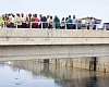 Members of the Parliamentary Select Committee on Works and Housing at the Odaw River project site