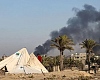 Smoke rises over western Deir al-Balah during an Israeli offensive on Monday