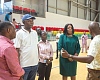 Kofi Adams (2nd from left), Minister of Sports and Recreation, being briefed during his visit to the Borteyman Sports Complex