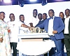 Alex Bram (middle), CEO, Hubtel, being assisted by Samuel Nartey George (3rd from left), Minister of Communication, Digital Technology and Innovations, Patience Enyonam Akyianu (left), CEO, Hollard Insurance, and some dignitaries to cut the cake to mark the 20th anniversary. Picture: ELVIS NII NOI DOWUONA 
