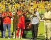 • President John Dramani Mahama (2nd from right) presenting the President's Cup trophy to Samba O’Neil, Kotoko’s captain, while Kofi Adams (right), Minister of Sports and Recreation, and Dr Frank Amoakohene (2nd from left), Ashanti Regional Minister, look on. Picture: Caleb Vanderpuye