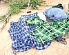 Covered bodies of some of the victims of the Volta Lake canoe disaster 
