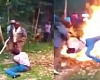 The man being brutally assaulted and thrown into a fire over allegations of chicken theft