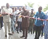 President John Dramani Mahama (middle) being assisted by Joseph Bukari Nikpe (left), Minister of Transport; Rev. Stephen Wilfred Arthur (2nd from right), acting Director-General, Ghana Civil Aviation Authority, and Muntaka Mohammed-Mubarak (right), Interior Minister, to commission the new ANS facility