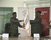 Maj. Gen. Emmanuel Wekem Kotia (left), outgoing Commissioner General, Ghana Boundary Commission, transferring the flag of authority to Brig. Gen. Anthony Ntem, new Commissioner General, Ghana Boundary Commission