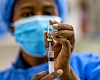 An infant waits to receive a dose of the RTS,S malaria vaccine, also known as Mosquirix, at the Mother and Child Hospital in Kasoa, Ghana, November 19, 2025. REUTERS/Francis Kokoroko/File Photo