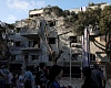 People gather at an impact site following Iran's strike on Israel, amid the Iran-Israel conflict, in Haifa, Israel, June 22, 2025. REUTERS/Florion Goga Purchase Licensing Rights