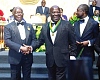 Otumfuo (left) congratulates Sir Sam Jonah