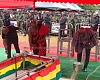 Families throwing sand on the caskets of the fallen patriots as part of the final rites during the burial ceremony. Pictures: ELVIS NII NOI DOWUONA
