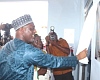 The new police hospital. INSET: Mohammed-Mubarak Muntaka, Minister for the Interior, unveiling the plaque to inaugurate the second police hospital in Kumasi