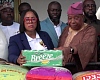 Linda Ocloo (middle) presneting the items to representatives of the Chief Imam