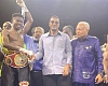 Referee Erasmus Owoo raises Faisal Abubakari’s hand in victory as Sharaf Mahama (centre), co-promoter,  congratulates him with a handshake