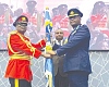 Major General Richard Addo Gyane (left), Commandant of KAIPTC, handing over the KAIPTC flag as a sign of authority to his successor, Air Commodore David Anetey Akrong (right), the Deputy Commandant of the KAIPTC, as Brogya Gyenfi, the Deputy Minister of Defence, looks on