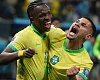 Vinícius Júnior (left) celebrates with Bruno Guimarães after scoring the Brazil goal that beat Paraguay. 