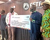Ebenezer Kwadwo Saka Addo-Mensah (2nd from right), CEO, Saka Homes, presenting the dummy cheque to Paul Adjei (4th from left), Administrator, GETFund. Looking on are Alexis Asuinura (right), Financial Controller, GETFund, and other officials of GETFund. Picture: ERNEST KODZI