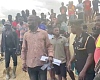 Umar Ahmed (arrowed), DCE for Denkyembour, the police and some town folk arriving at the galamsey site where over 20 illegal miners were trapped 