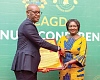 Kwasi Agyei (left), the Controller and Accountant-General, presenting a citation to Vice-President Prof. Naana Jane Opoku-Agyemang for her distinguished  public service
