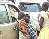 Child beggars harassing an occupant of a vehicle