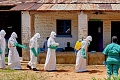 Red Cross volunteers are conducting safe burials for Ebola victims to prevent the virus from spreading