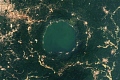 A more recent satellite photo, captured in 2024, shows that the level of gold mining around Lake Bosumtwe has increased significantly over the last decade. | Credit: NASA/Landsat
