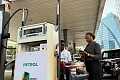 A customer stands beside a fuel attendant while buying petrol at an NNPC filling station, as fuel costs rise amid the U.S.-Israeli conflict with Iran, in Ikoyi, Lagos, Nigeria, March 9, 2026. REUTERS/Sodiq Adelakun/File Photo