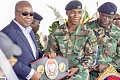 Jerry Lartey presenting his WBA International Super Lightweight title to President John Mahama (left) during the recent WASSA event at Burma Camp, Accra