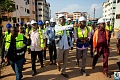Mr Courage Nunekpeku ( with hand stretch) Managing Director of TDC Ghana Ltd conducting Mr Kenneth Gilbert Adjei, (2nd left) Minister of Works Housing and Water Resources round the buildings at the Kpone Affordable Housing Project site.