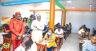 Haruna Iddrisu (right), Education Minister, joined by Dr Christian Addai-Poku, Registrar of the National Teaching Council (NTC), observing a candidate writing the exams