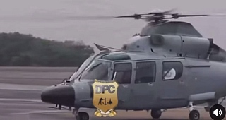 Dr Edward Kofi Omane Boamah in white waving moments before the helicopter took off