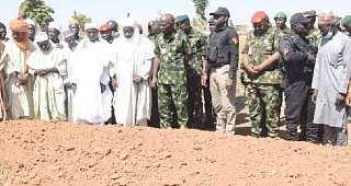  Lieutenant General Taoreed Lagbaja (arrowed), Nigeria’s Chief of Army Staff, with other community leaders praying at the grave of victims of an army drones attack