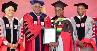 Prof. Fred McBagonluri (2nd from left), Founding President, Academic City University, presenting the overall best student award to Joseph Apiriala-Ateboghu (2nd from right), the valedictorian. Picture: ELVIS NII NOI DOWUONA
