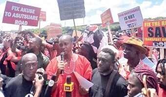 Isaac Tamatey (arrowed), Chairman of Kloma Hengme, reading the petition